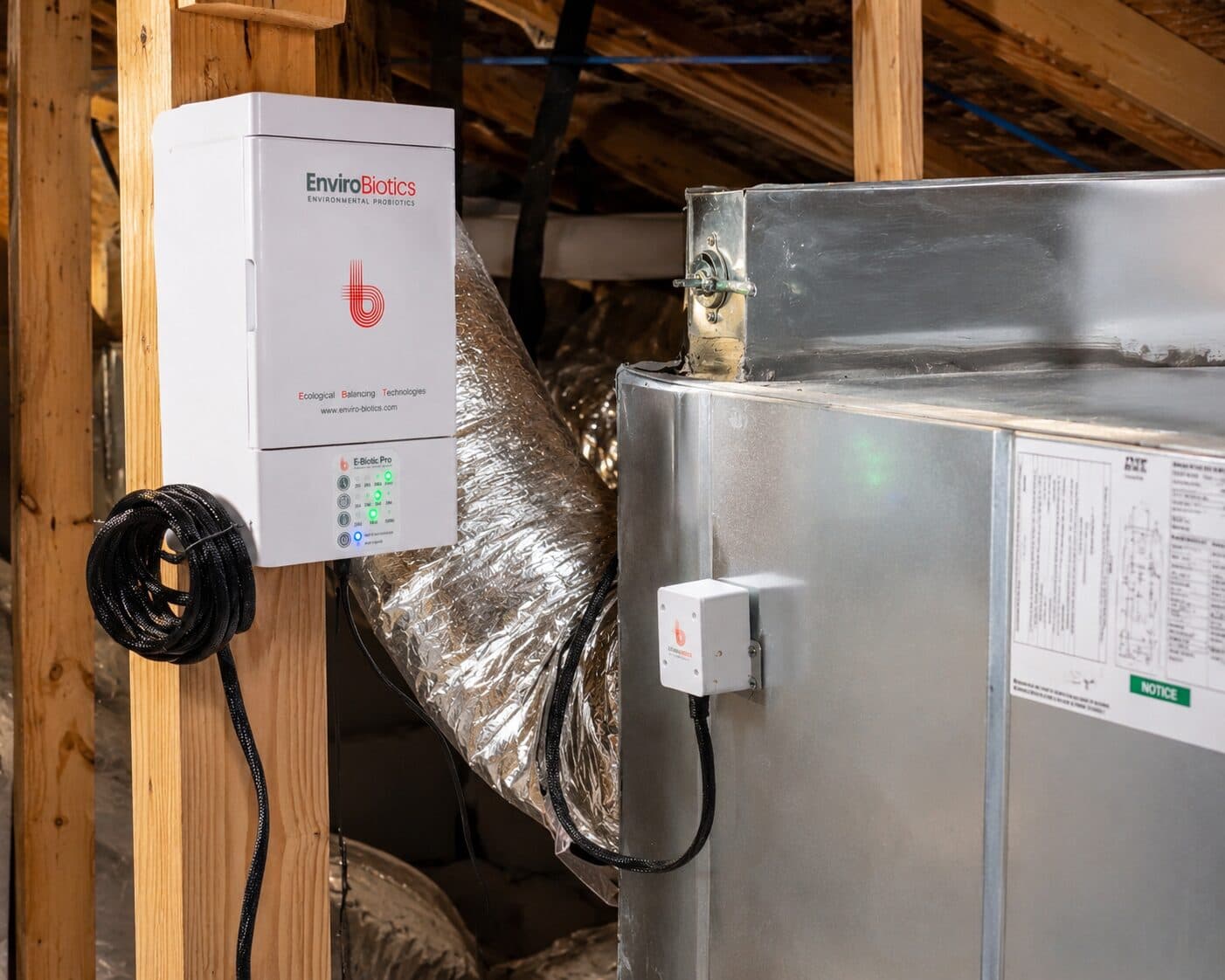 An E-Biotic Pro installed beside the air handler in an attic